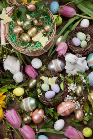 Close up of Easter assortiment of Easter eggs, spring flowers, and toys.の写真素材