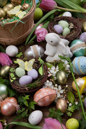 Close up of Easter assortiment of Easter eggs, spring flowers, and toys.の写真素材