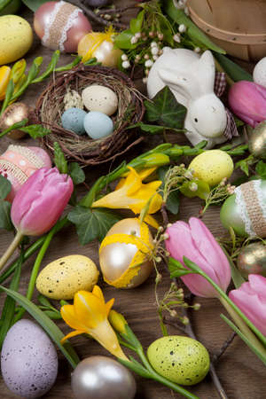 Close up of Easter assortiment of Easter eggs, spring flowers, and toys.の写真素材