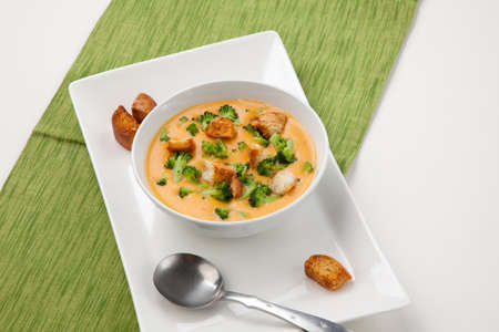 Close up of hot delicious broccoli - cheddar cheese soup with garlic croutons.の写真素材