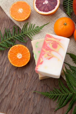 Spa set - handmade citrus oil organic soap, fresh oranges, and fern. Best suited for relaxing and health commercials.の写真素材