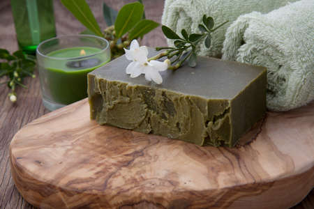 Spa set - assorted handmade organic soap, fresh Jasmine flowers, and bottle of organic oil for spa treatment.の写真素材