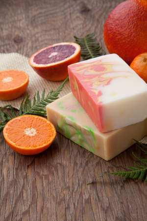 Spa set - handmade citrus oil organic soap, fresh oranges, and fern. Best suited for relaxing and health commercials.の写真素材