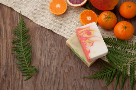 Spa set - handmade citrus oil organic soap, fresh oranges, and fern. Best suited for relaxing and health commercials.の写真素材