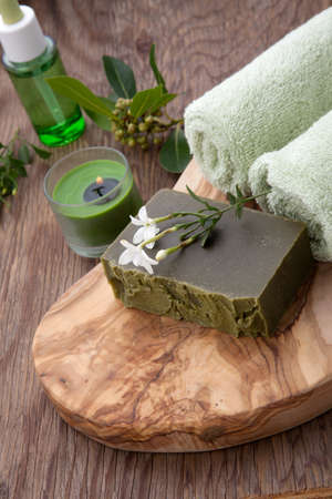 Spa set - assorted handmade organic soap, fresh Jasmine flowers, and bottle of organic oil for spa treatment.の写真素材