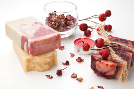 Spa set - handmade rose organic soap, dried rose flowers, and rosehips. Best suited for relaxing and health commercials.の写真素材