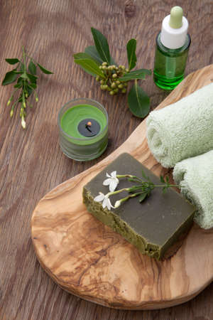 Spa set - assorted handmade organic soap, fresh Jasmine flowers, and bottle of organic oil for spa treatment.の写真素材