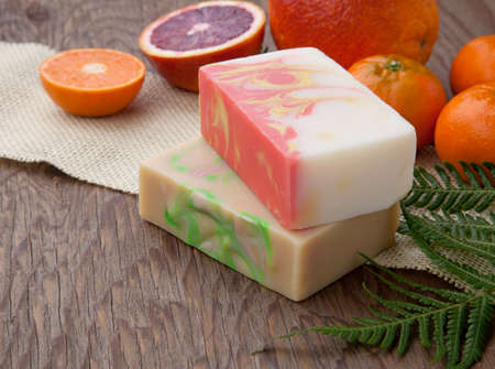 Spa set - handmade citrus oil organic soap, fresh oranges, and fern. Best suited for relaxing and health commercials.の写真素材