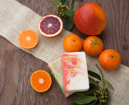 Spa set - handmade citrus oil organic soap, fresh oranges, and fern. Best suited for relaxing and health commercials.の写真素材