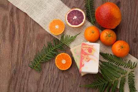 Spa set - handmade citrus oil organic soap, fresh oranges, and fern. Best suited for relaxing and health commercials.の写真素材