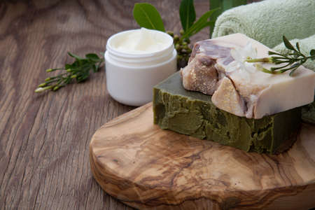 Spa set - assorted handmade organic soap, fresh Jasmine flowers, and jar of moisturizing face cream for spa treatment.の写真素材