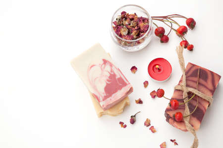 Spa set - handmade rose organic soap, dried rose flowers, and rosehips. Best suited for relaxing and health commercials.の写真素材