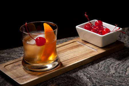 Whiskey based cocktail - closeup of Old Fashioned Whiskey Cocktail on bar counter.の写真素材