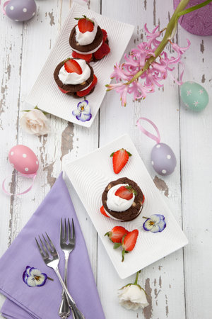 Easter theme deserts - strawberry chocolate Napoleons served with fresh strawberries. Three...