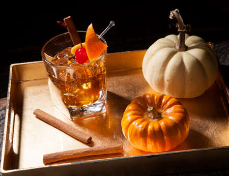 Closeup of Old Fashioned Whiskey Cocktail at a bar ready to be served.の写真素材