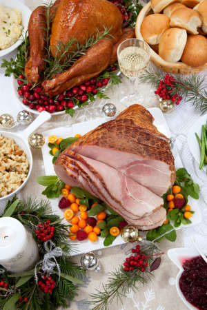 Roasted ham garnished with fresh raspberry, kumquat, and mint.の写真素材