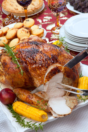 Carving garnished traditional fall roasted turkey garnishedの写真素材