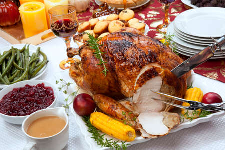 Carving garnished traditional fall roasted turkey garnishedの写真素材