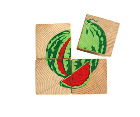 children's toy, wooden cubes, puzzle, watermelon on a white backgroundの写真素材