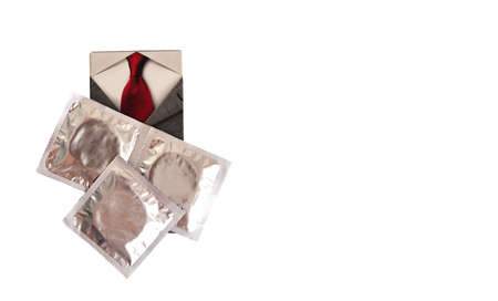 three condoms, red tie on white backgroundの写真素材