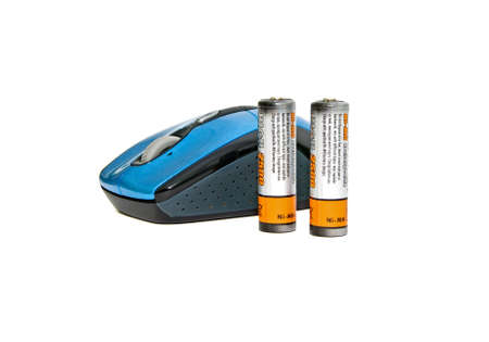computer mouse and the battery on a white backgroundの写真素材