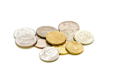 coins of different denominations closeup on white background