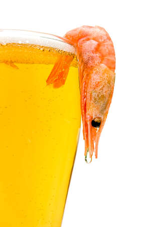 glass of light beer and shrimp on a white backgroundの写真素材