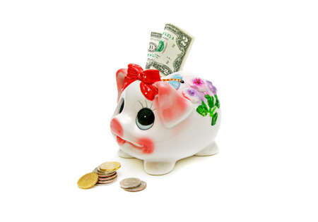 coins and a piggy bank and $ 2 on a white backgroundの写真素材