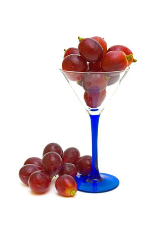 ripe grapes in a glass on a white backgroundの写真素材