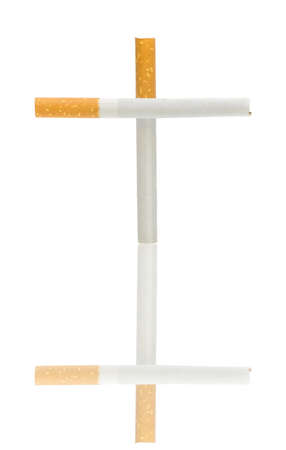 cigarettes in the form of a cross on a white background with reflection - no smokingの写真素材