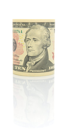 $ 10 bill on a white background with reflection closeup