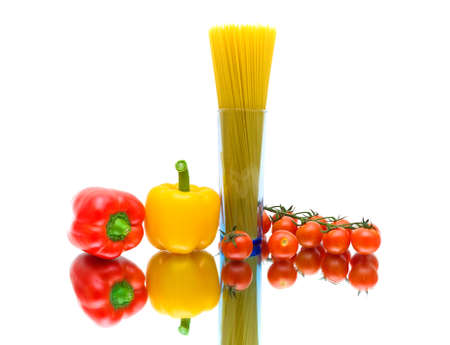 pepper, pasta and cherry tomatoes on a white background with reflection. horizontal photo.の写真素材