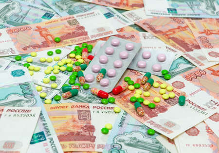 different medical drugs on the background of banknotes. horizontal photo.の写真素材