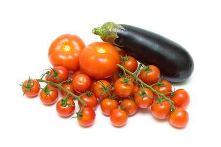 tomatoes and eggplant isolated on white background. horizontal photo.の写真素材