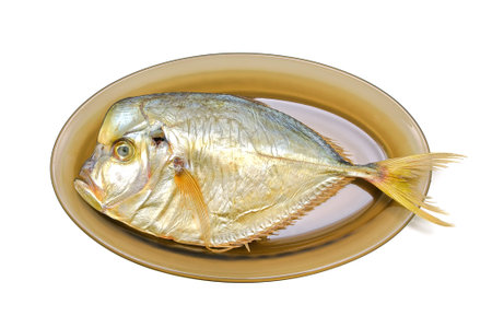 Vomer fish smoked on a plate on a white background. 