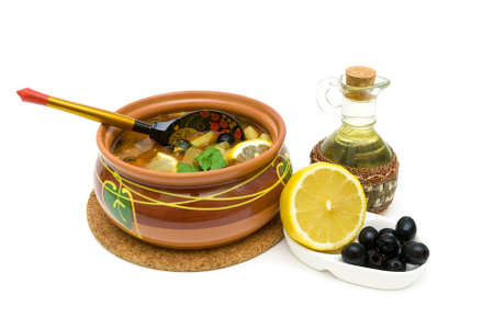 Dish of russian hodgepodge soup in ceramic pot isolated on white background. horizontal photo.の写真素材
