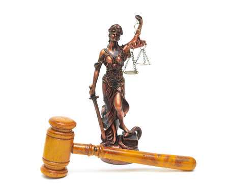 judges gavel and the statue of justice on a white background close-up. horizontal photo.の写真素材