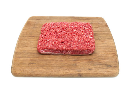 minced beef on a cutting board. white background - horizontal photo.の写真素材