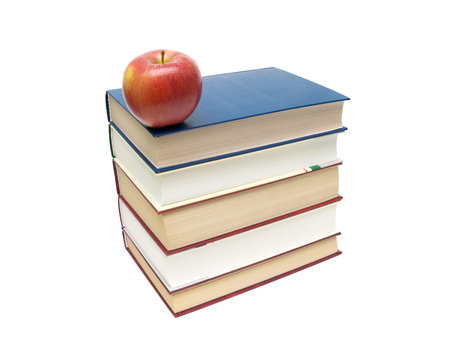stack of books and red apple isolated on white background