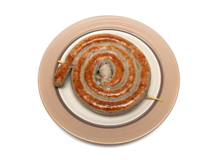 appetizing grilled sausages on a plate on a white background. horizontal photo.の写真素材