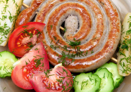 grilled sausages with vegetables and dill close-up. horizontal photo.のeditorial素材
