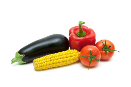 tomatoes, corn, eggplant and pepper closeup. white background - horizontal photo.の写真素材