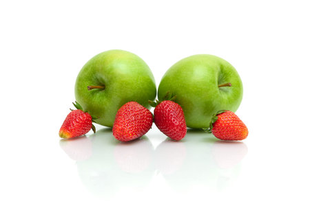 Ripe strawberries and green apples on a white background. horizontal photo.の写真素材