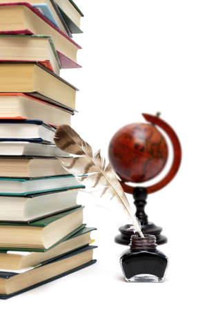 Ink, pen and book on a white background. Vertical photo.の写真素材