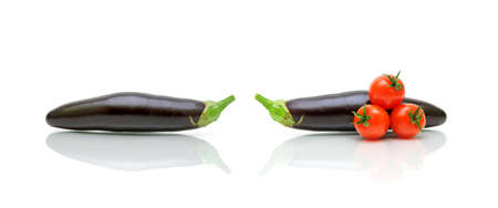 eggplants and cherry tomatoes on a white background. horizontal photo.の写真素材
