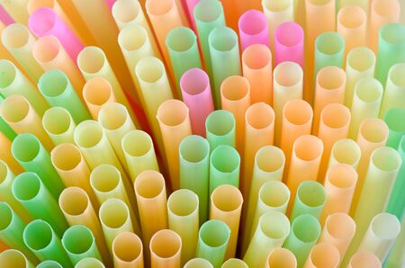 Multicolored plastic tubes for drink loose macro photoの写真素材