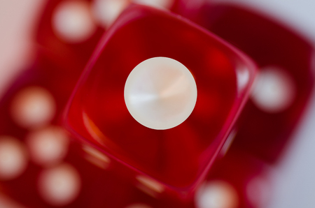Red dice Macro shooting against the background of diceの写真素材