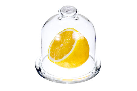 Half a lemon in a glass flask for foodの写真素材