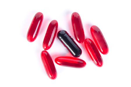 Red pills word life on a white background heartの写真素材