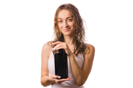 Beautiful young woman wet hair shampoo on white background isolationの写真素材